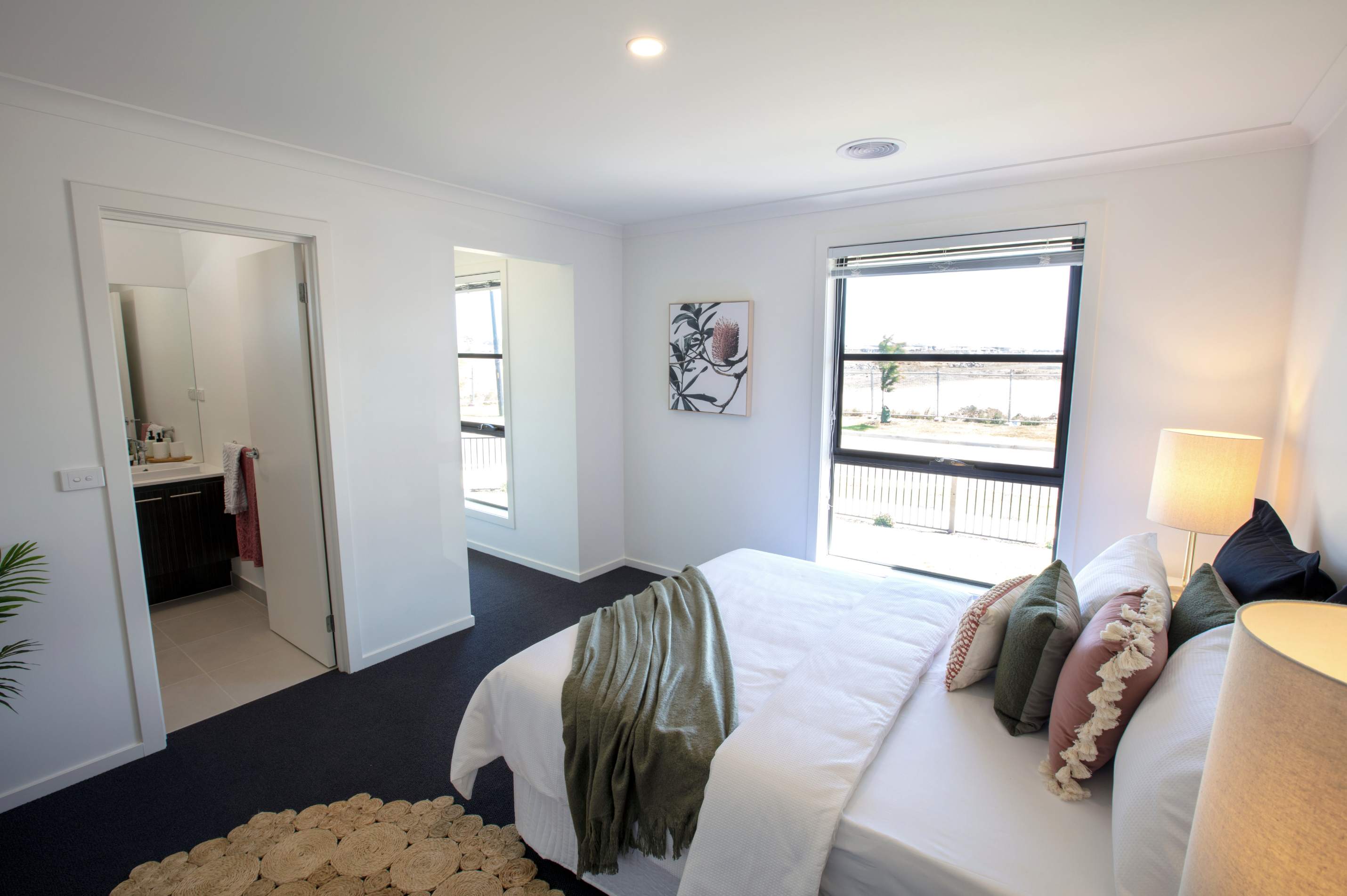 Master bedroom with view to the bathroom in the Winterfield Estate project.